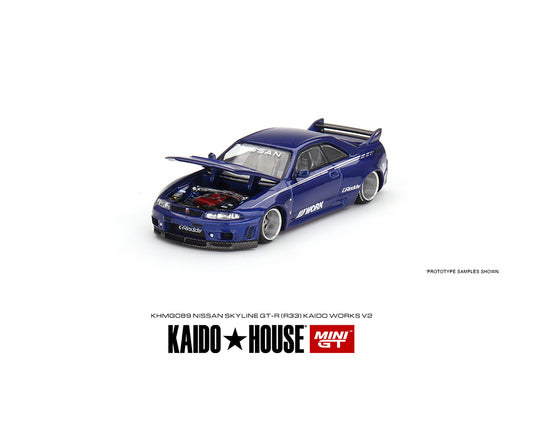 A front angled view of the Mini GT Kaido House Nissan Skyline GTR R33 in blue on a white background with the hood open.