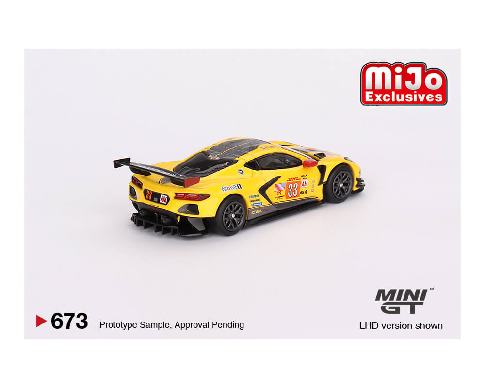 Mini GT Chevrolet Corvette IMSA GTD PRO yellow livery on white background showing the rear of the car.