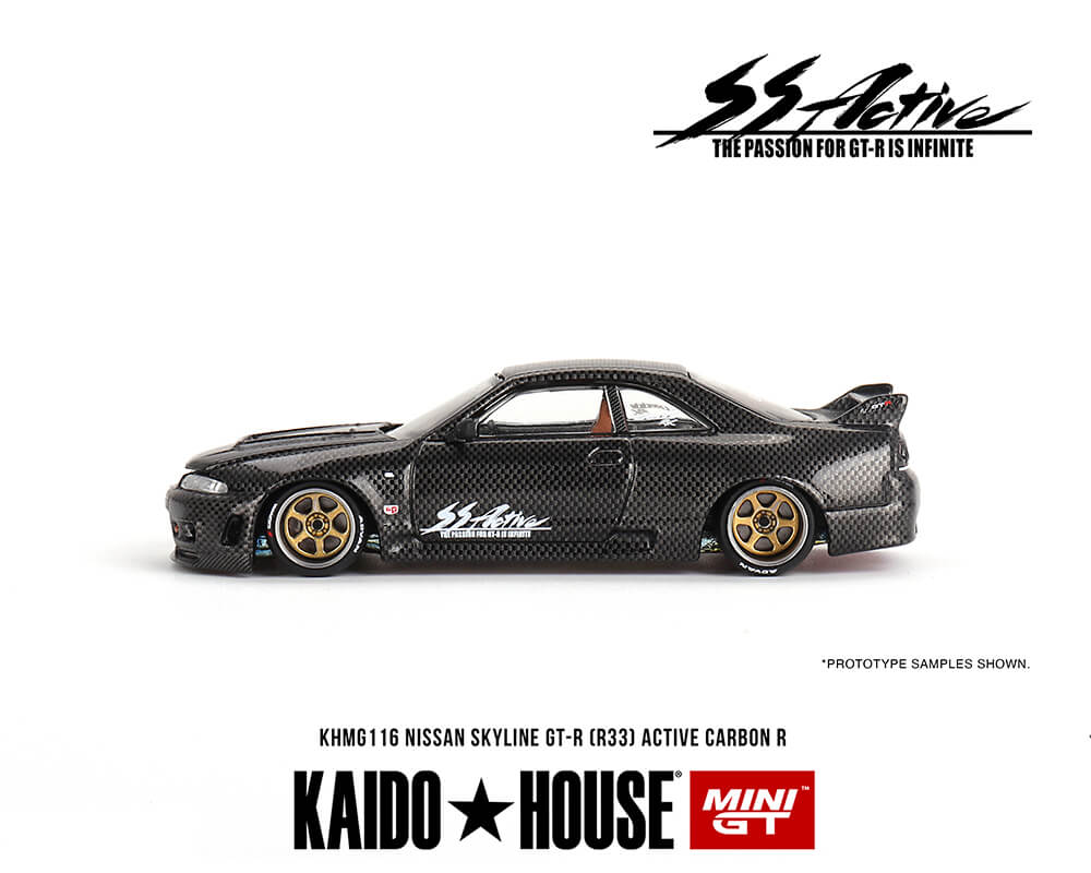Side view of a Mini GT Kaido House Nissan GT-R R33 Active Carbon R diecast car on a white background.